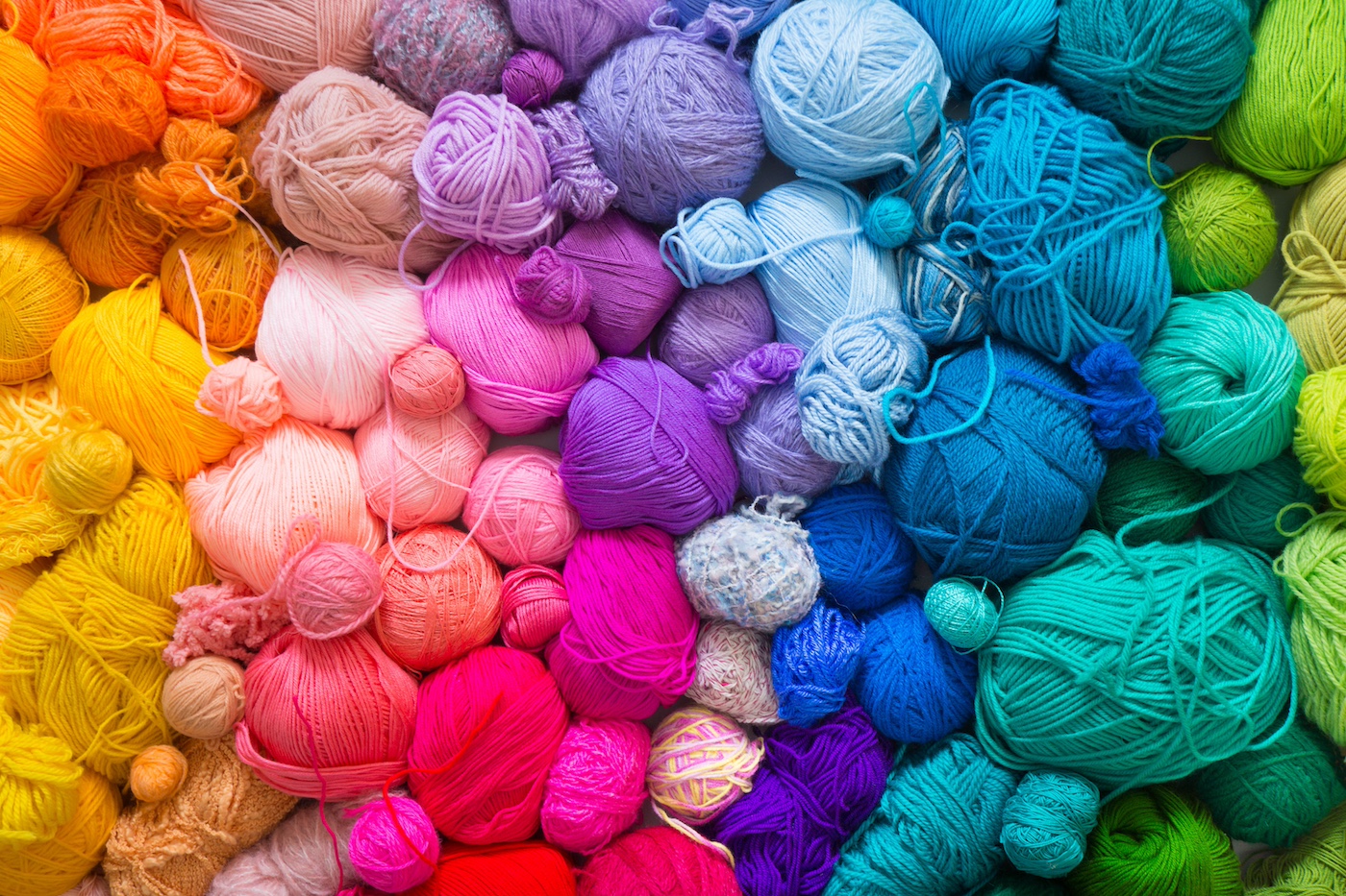 Crafted Loops Sales Store -Crafted Loops Sales Store Pile of rainbow yarn in various colors